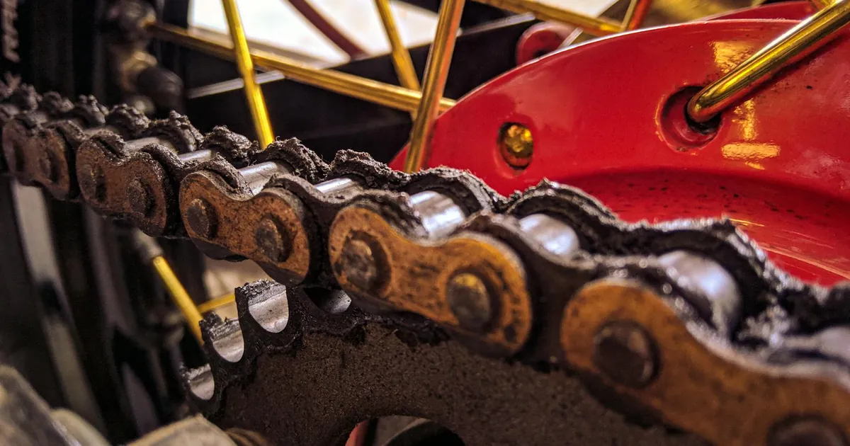 Closeup of bicycle transmission system with metal chain on hydraulic disk brake on wheel