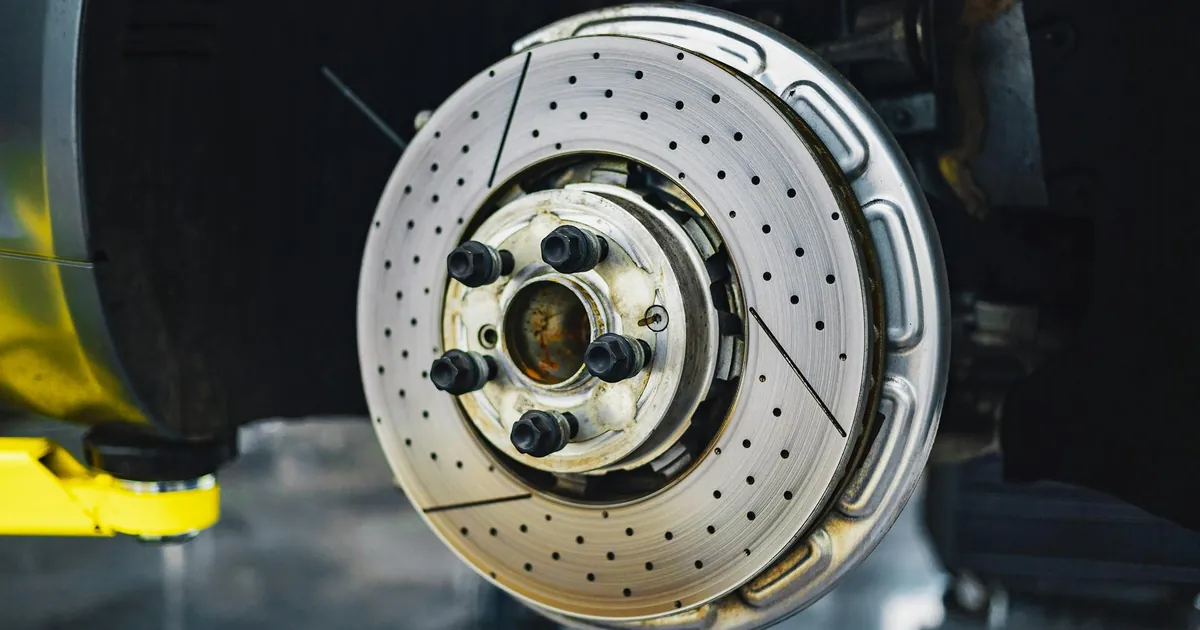 Detailed view of a car brake disk showcasing automotive parts and craftsmanship.