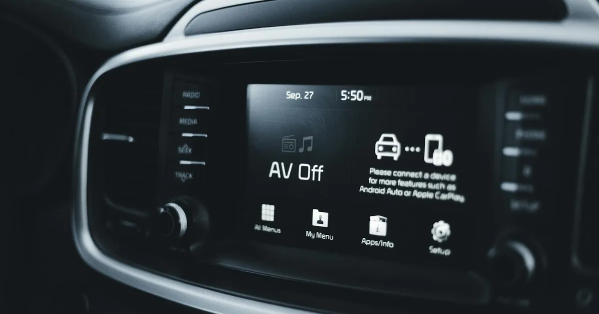 Detailed close-up of a modern car dashboard screen displaying various tech options and settings.