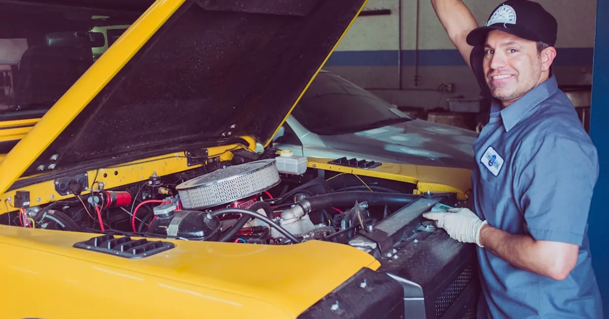 man holding open-wide car trunk