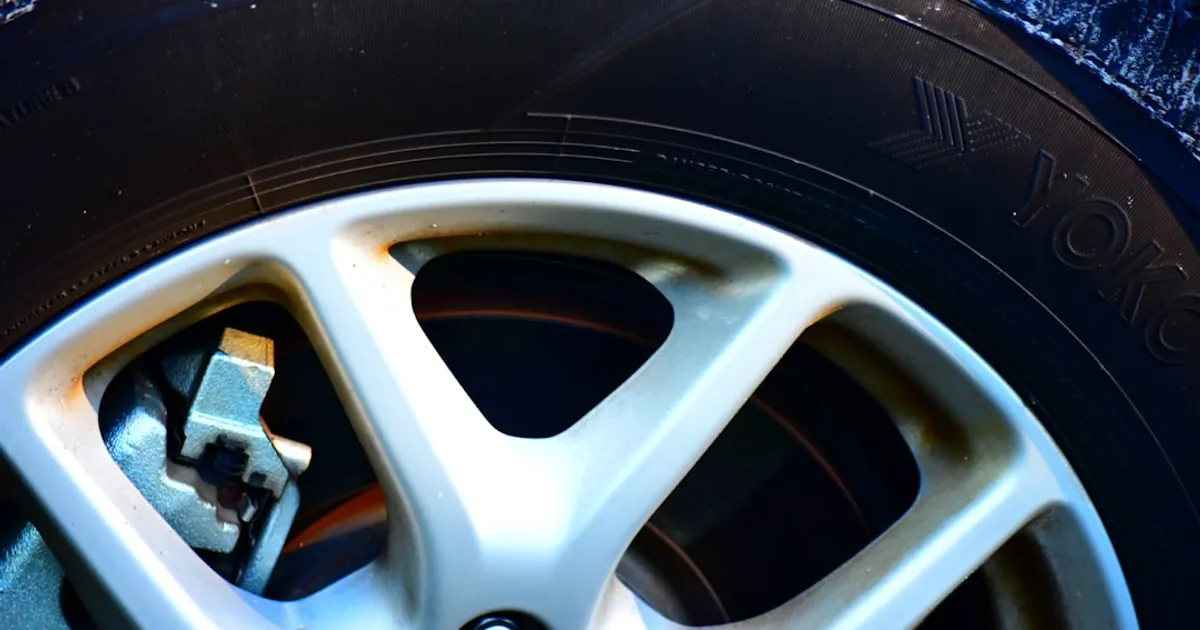 Close-up of a car's alloy wheel and tire.
