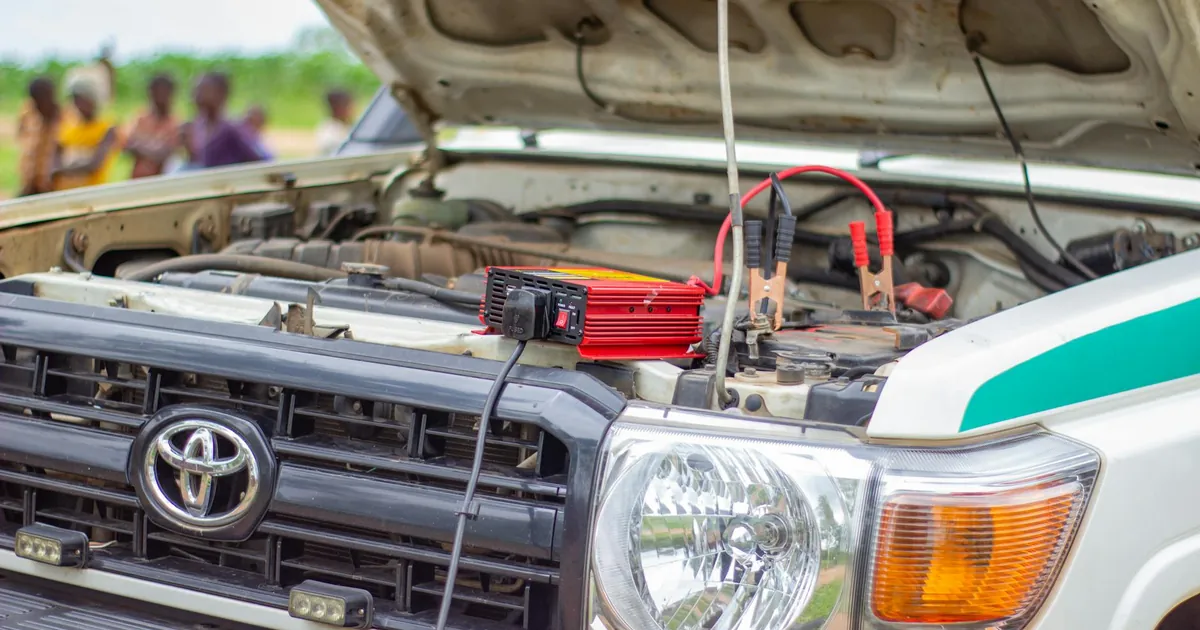Close-up of car engine with battery charger in Blantyre, Southern Region, Malawi.