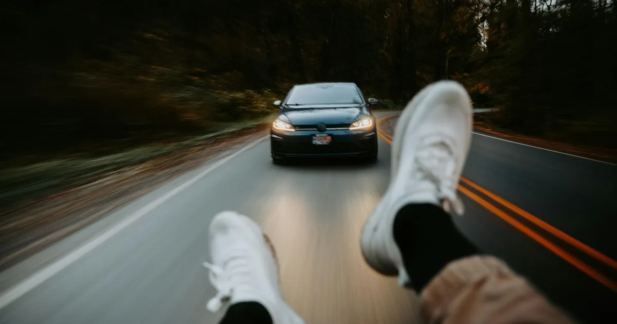Exciting point-of-view shot showing a car following on a winding road, capturing the thrill of the drive.